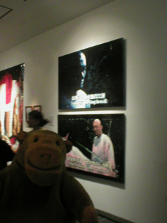 Mr Monkey looking at Chow Chun-Fai's paintings