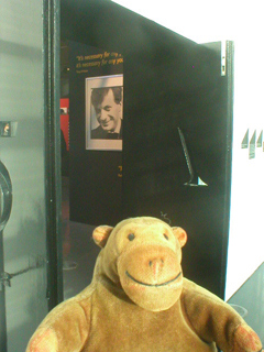 Mr Monkey looking at the original doors to the Haçienda