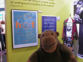 Mr Monkey looking at posters and clothes from the ecstasy period