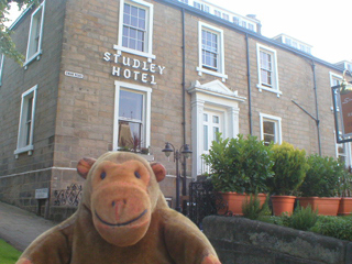 Mr Monkey outside the Studley Hotel