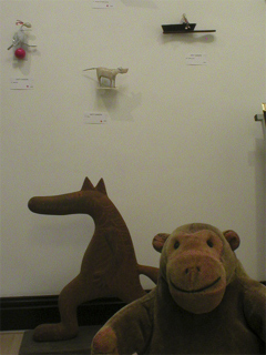 Mr Monkey looking at a display of Lucy Casson sculptures