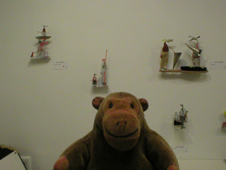 Mr Monkey looking at a display of Lucy Casson sculptures