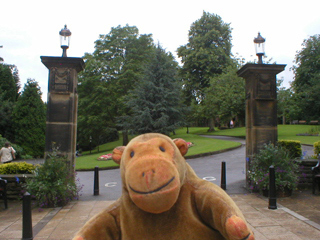 Mr Monkey in front of the entrance pillars of the Valley Gardens