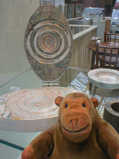 Mr Monkey looking at laminated paper work by Hannah Lobley