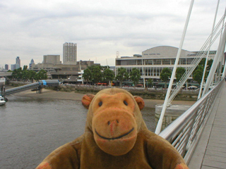 Mr Monkey crossing Hungerford footbridge