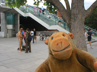 Mr Monkey watching a gold-painted man having a break