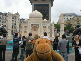 Mr Monkey looking looking at a model Taj Mahal in Trafalgar Square