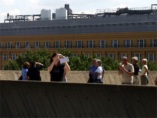 People on a sculpture terrace looking for Event Horizon figures