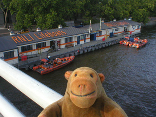 Mr Monkey looking at the lifeboat station beside Waterloo Bridge