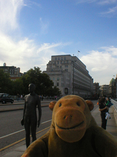 Mr Monkey looking at the Gormley at the northern end of Waterloo Bridge