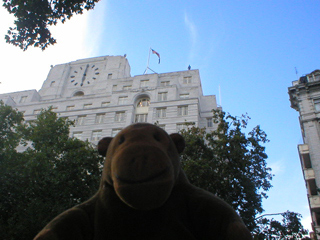 Mr Monkey looking up at Shell Mex House