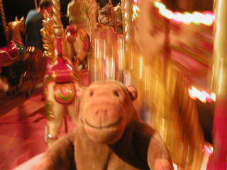 Mr Monkey riding the carousel in the dark