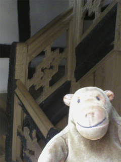 Mr Monkey looking at the reconstructed staircase