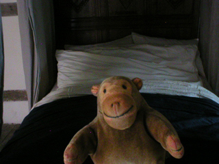 Mr Monkey looking at the 17th century bed