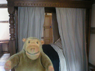 Mr Monkey looking at the 17th century bedroom