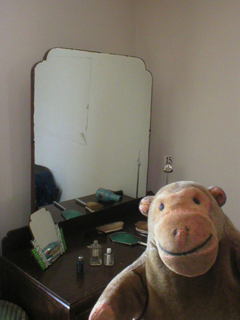 Mr Monkey examining the 1940's dressing table