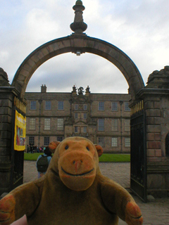 Mr Monkey looking through the main gate of Lyme Hall