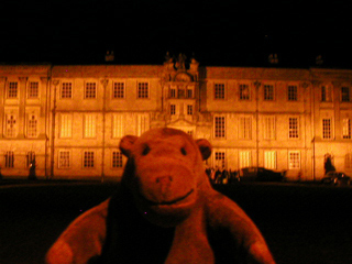 Mr Monkey in front of Lyme Hall in the dark