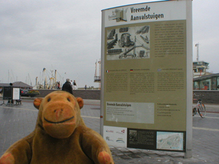 Mr Monkey looking at the Strange Contraptions board