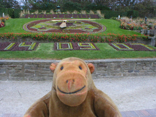 Mr Monkey looking at the Floral Clock