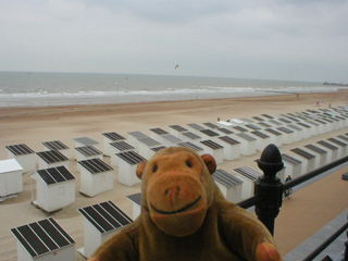 Mr Monkey looking over the beach huts towards Ostende from his terrace