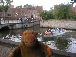 Mr Monkey watching a tour boat turn around near the lock house