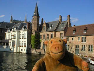 Mr Monkey looking at houses on the other side of the canal