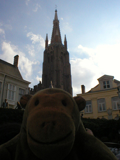 Mr Monkey approaching Onze Lieve Vrouwekerk by boat