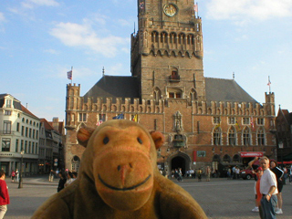 Mr Monkey looking at the Belforthallen of Bruges
