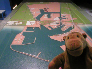 Mr Monkey looking at a model of the modern port of Zeebrugge