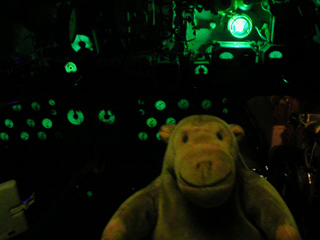 Mr Monkey looking at the luminous dials and controls