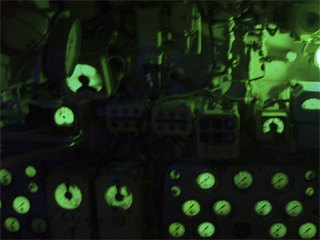 A bank of luminous dials and controls