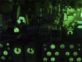 A bank of luminous dials and controls