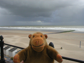 Mr Monkey watching a small boat trying to leave the beach