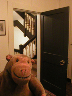 Mr Monkey looking at the door of the Will Room