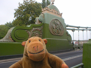 Mr Monkey looking at one of the anchors of the Hammersmith Bridge