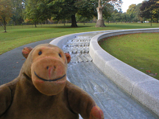 Mr Monkey walking up the left hand side of the Diana Memorial Fountain