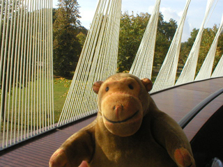 Mr Monkey examining the cables on the Serpentine Gallery Pavilion