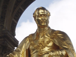The statue of Prince Albert sitting on his memorial
