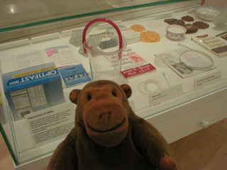 Mr Monkey looking at a display of anti-obesity treatments