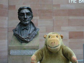 Mr Monkey looking at the bust of Barbirolli outside the Bridgewater