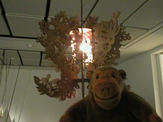 Mr Monkey looking up at Lisa Cheung's Chinese Princess chandelier