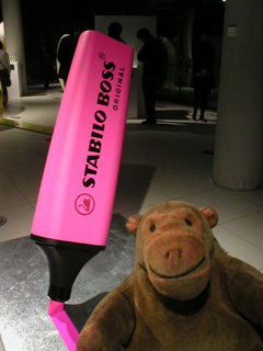 Mr Monkey looking at a giant highlighter pen