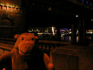 Mr Monkey looking downriver from under the Hungerford bridges
