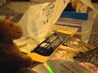 Mr Monkey packing goodies into a goodie bag