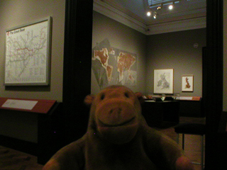 Mr Monkey looking around the Mapping the Imagination exhibition