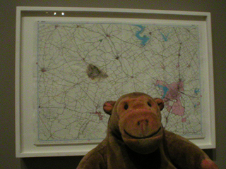 Mr Monkey looking at Cornelia Parker's 'Meteorite Misses Waco, Texas'