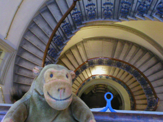 Mr Monkey looking down the stairwell of the Courtauld Gallery