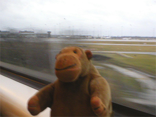 Mr Monkey passing Birmingham airport by train