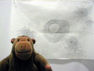 Mr Monkey looking up at a drawing by Ping Qui